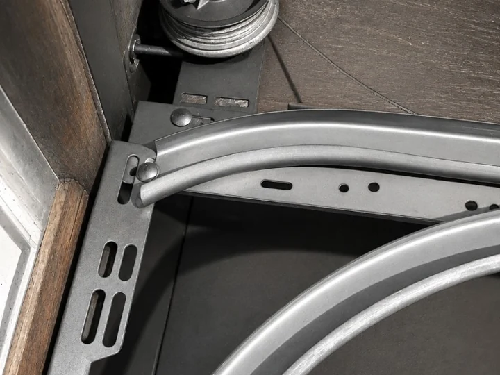 Curved galvanised garage door tracks with mounting bracket and cable drum